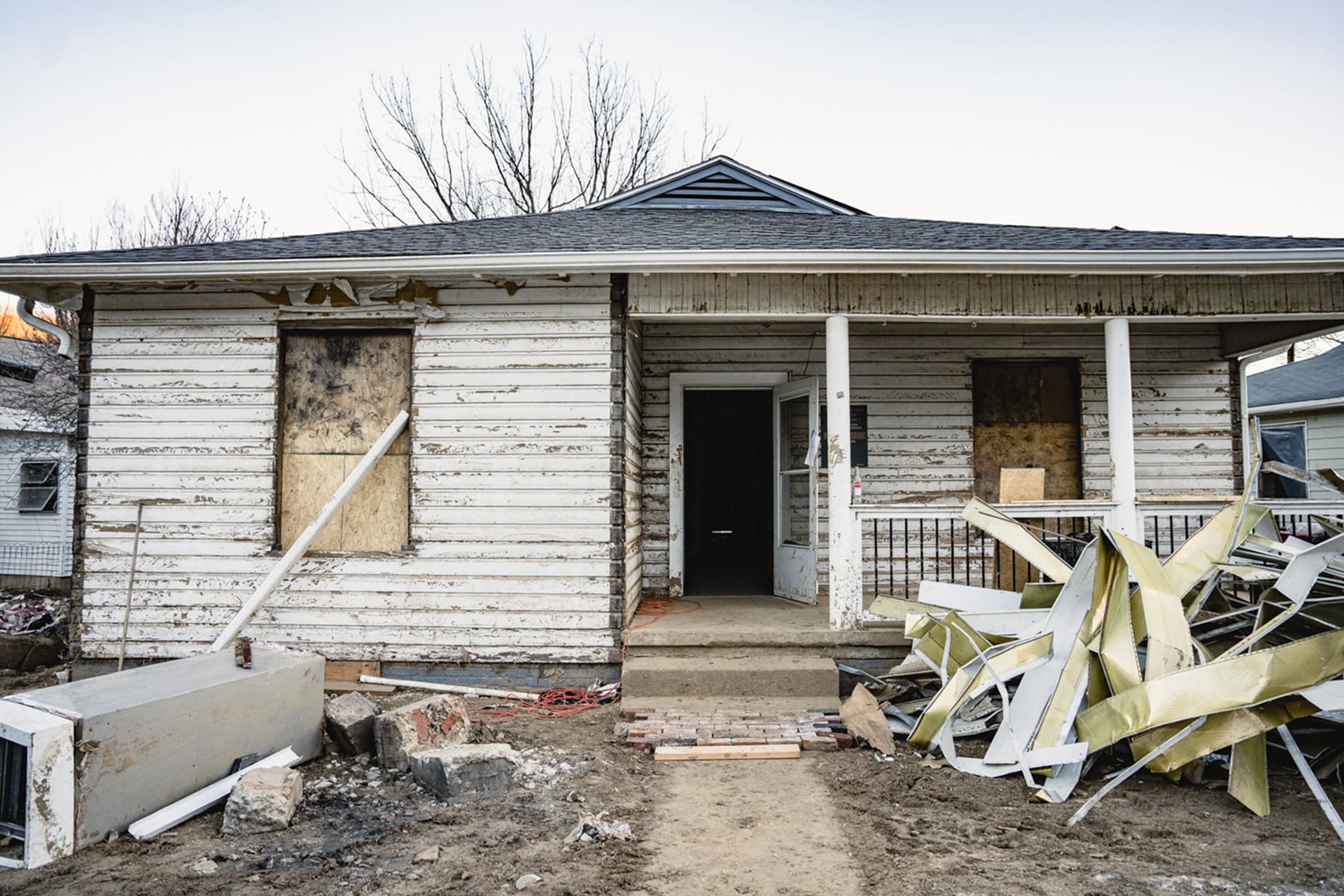 Shown: Jim and Allie's house. Their house was submerged to the rafters when 12 feet of water overran the banks of the Swannanoa River. | Fiasco Media