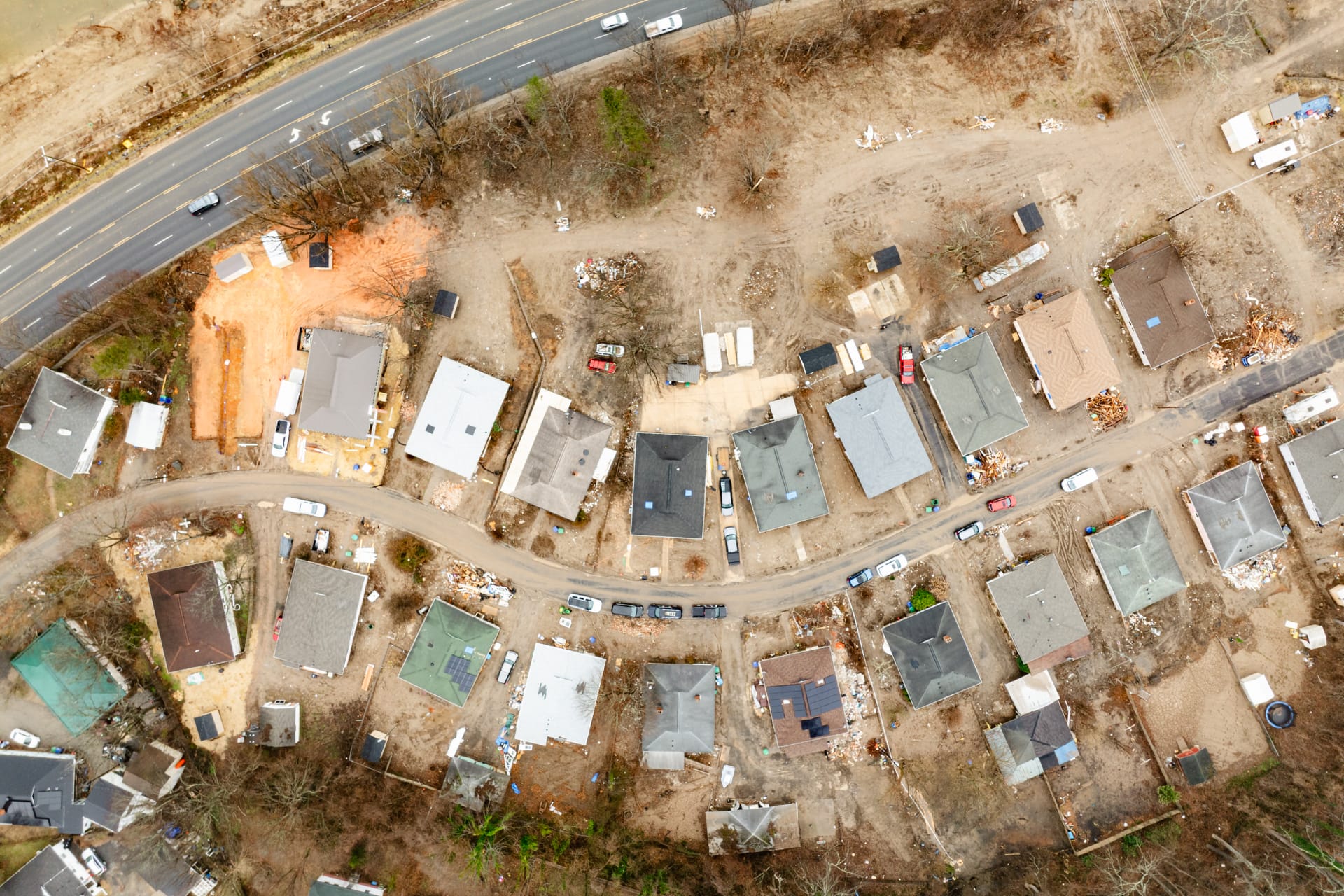 Taken in February 2025, just six months after the hurricane, this photo shows an aerial view of Beacon village where three of the project houses are located. | Fiasco Media